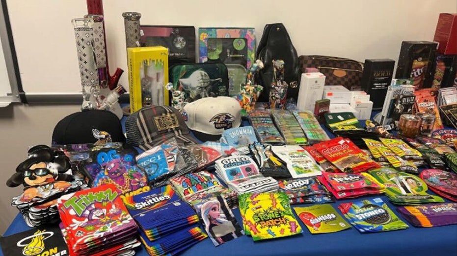 A large group of weapons, drugs and THC-infused candy was seized by officials