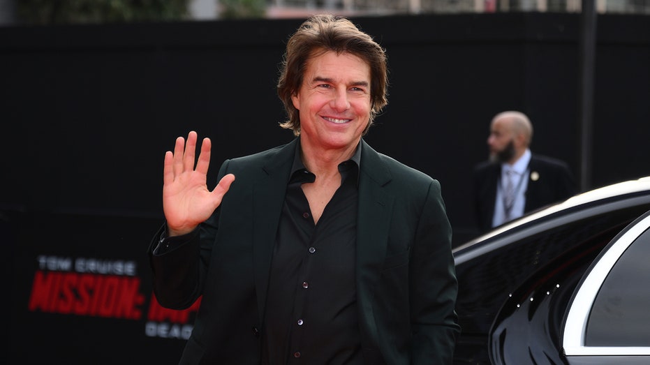 Tom Cruise waving