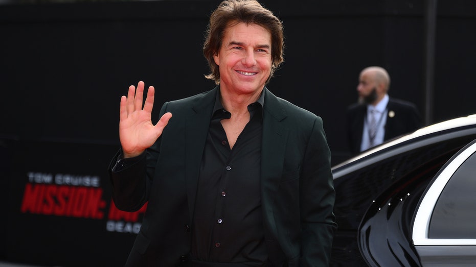 Tom Cruise waving