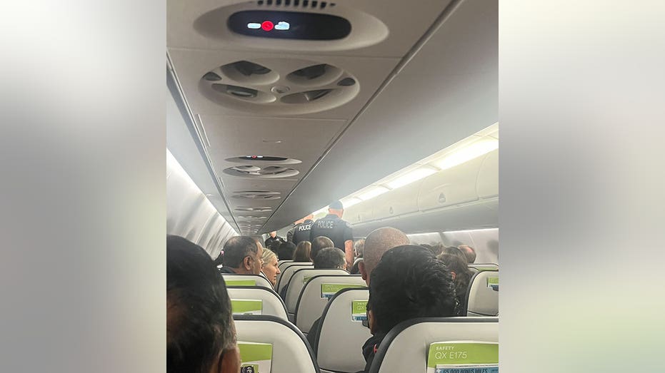 inside flight after off-duty pilot caused disturbance