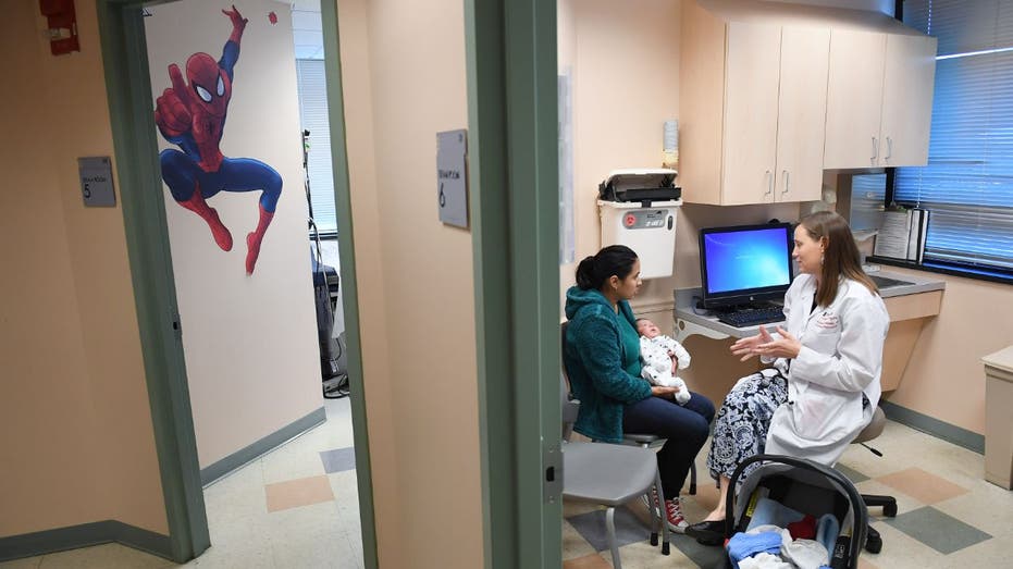 mom with baby at doctor