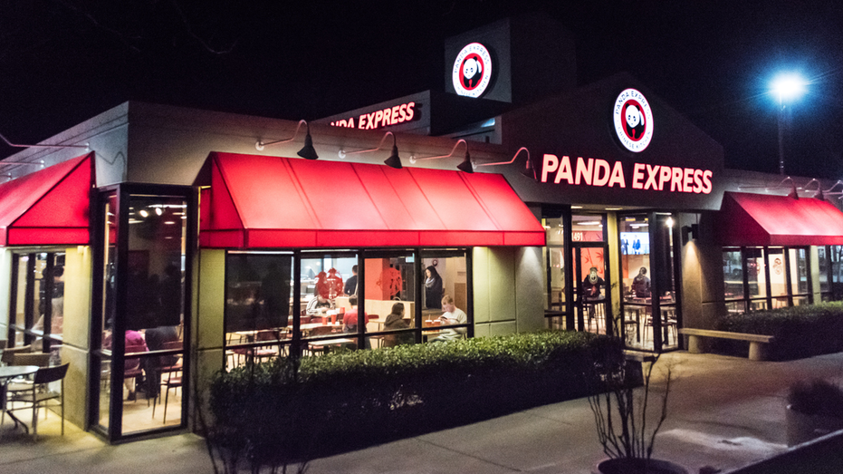 Panda Express restaurant exterior at night on East Cowell Boulevard in Davis, California.