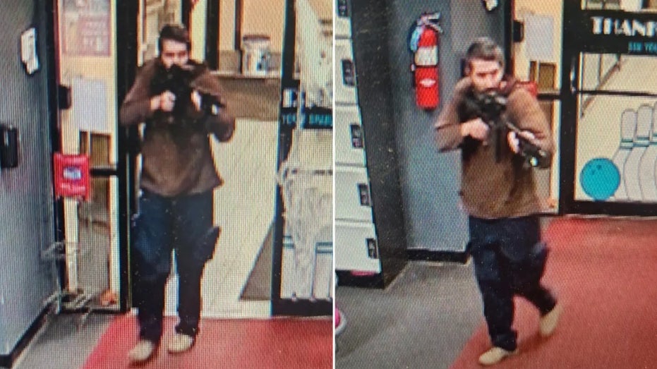 Picture of Robert Card holding a gun as begins his shooting rampage
