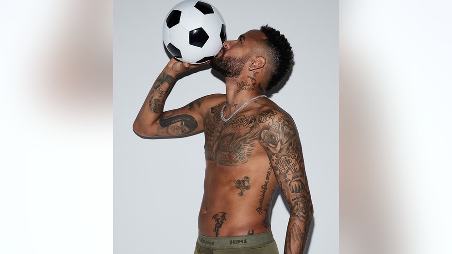 Neymar Jr. kissing soccer ball