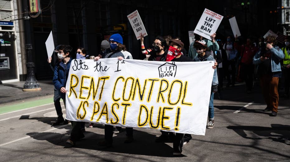 protesters march in support of Illinois lifting rent control ban