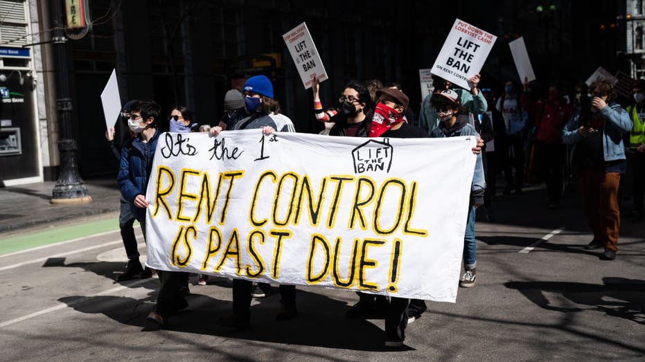 protesters march in support of Illinois lifting rent control ban