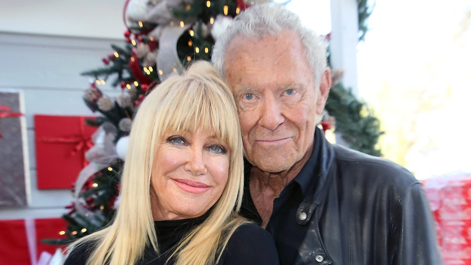 Suzanne Somers and husband Alan Hamel embrace each other