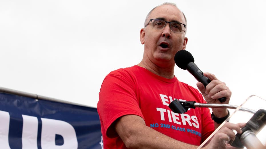 UAW Shawn Fain speaks at a rally