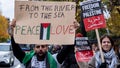A protester holds up a placard which reads 'From the river to the sea, peace and love' following last weekends pro-Palestinian ceasefire now demonstration, hundreds of protesters gathered at Highbury Corner in Islington for a March for Palestine to call for peace in Gaza on 18th November 2023 in London, United Kingdom. Major demonstrations in the capital did not occur this weekend, and instead smaller protests took place adding up to many thousands of people all over the city and country to call an end to the Hamas-Israel conflict. 