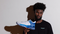 NBA player Jonathan Isaac poses with the JUDAH 1, a basketball shoe he designed. 