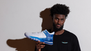NBA player Jonathan Isaac poses with the JUDAH 1, a basketball shoe he designed.  - Fox Business News