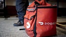 A DoorDash Inc. delivery bag sits on the floor at Chef Geoff's restaurant in Washington, D.C., U.S., on Thursday, March 26, 2020.  - Fox Business News