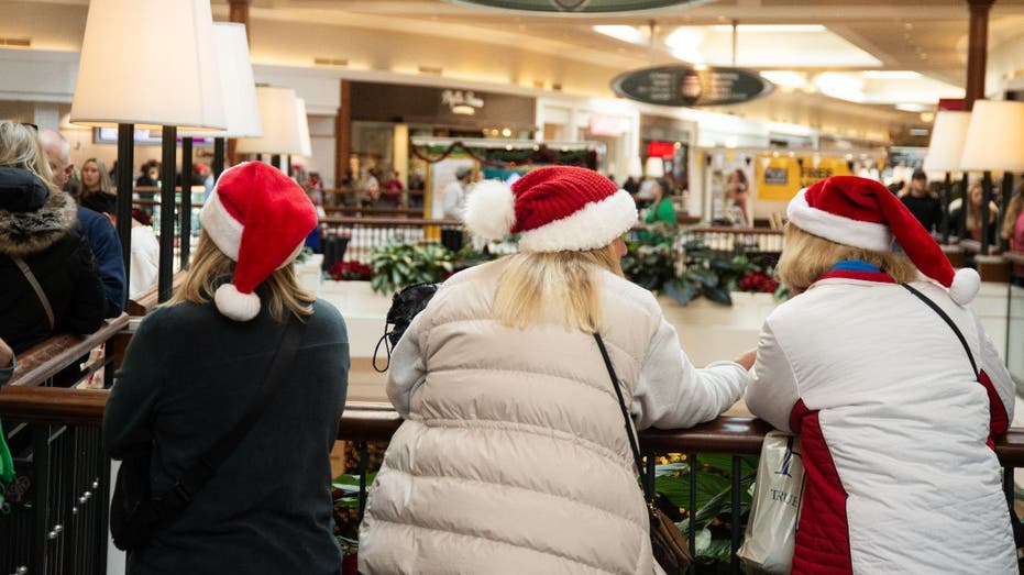 shoppers in santa hats