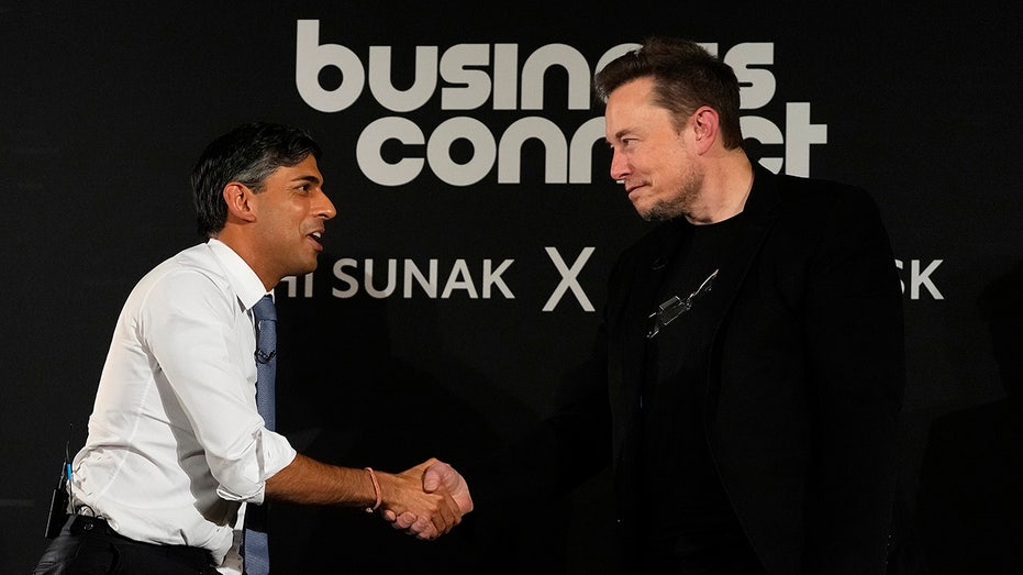 Musk shakes hands with British PM Sunak