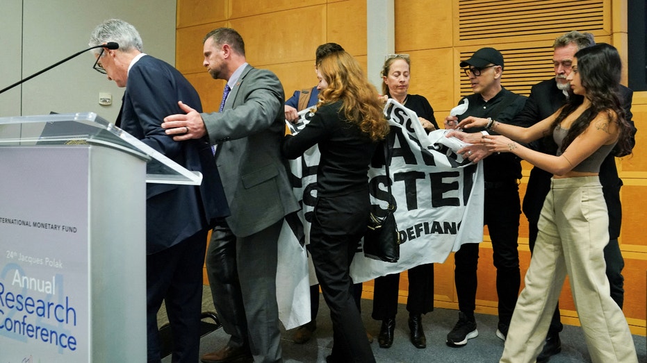 Federal Reserve Jerome Powell climate protesters IMF