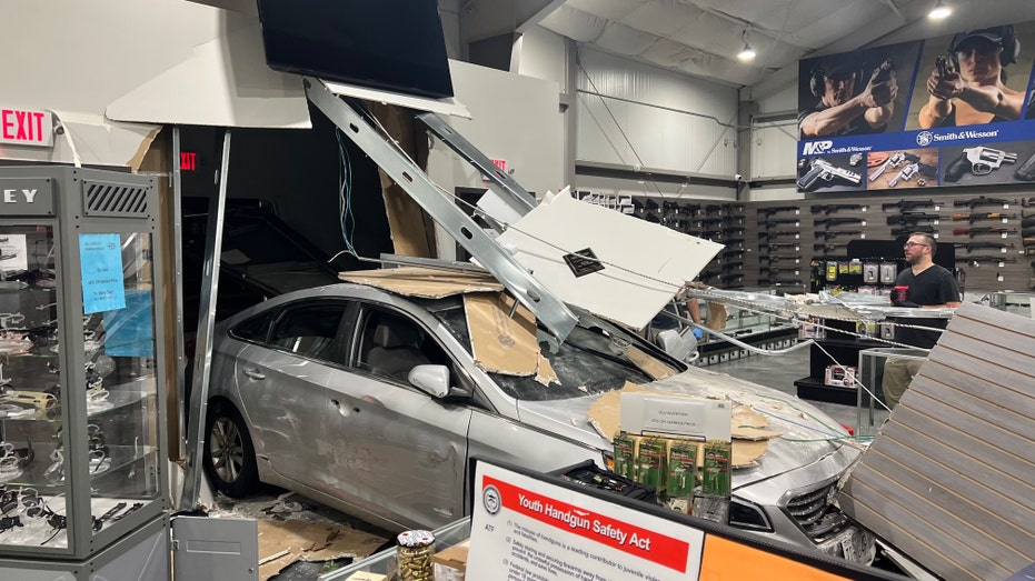 car crashed through front of gun store