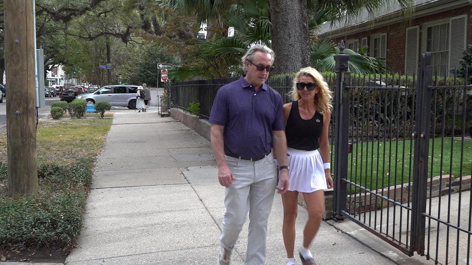 Couple walking down street