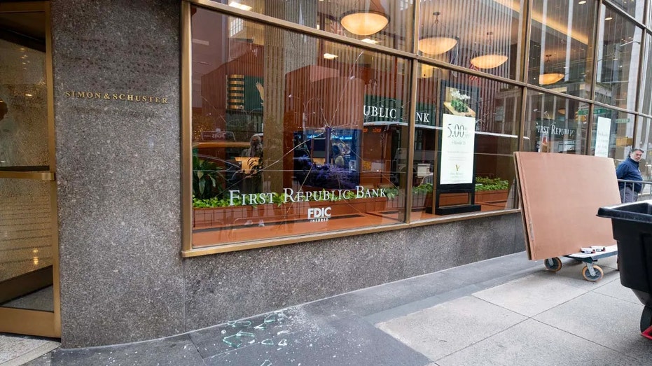 Smashed windows are seen outside of First Republic Bank in Midtown Manhattan