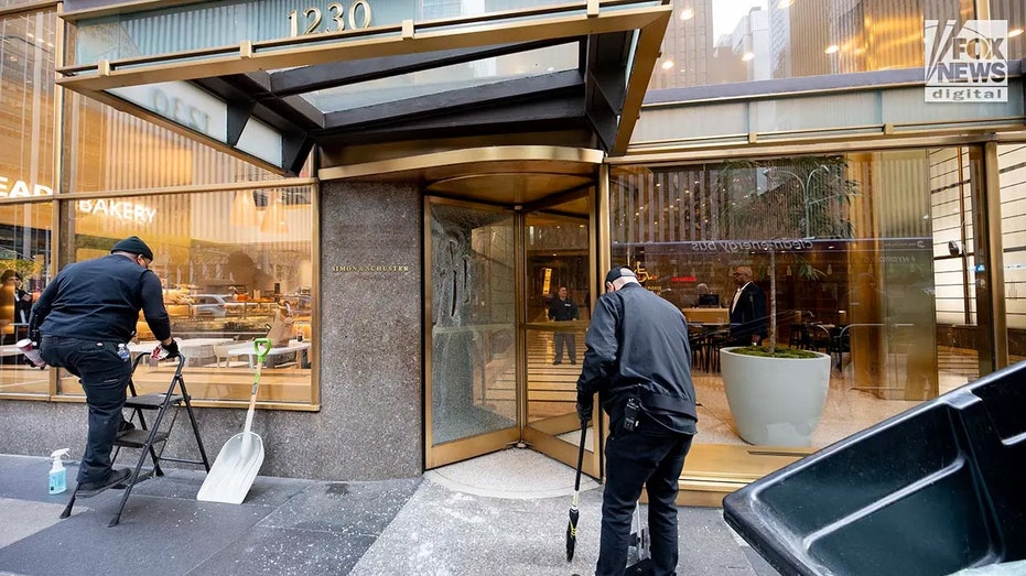 Smashed windows are seen outside of First Republic Bank and Simon & Schuster