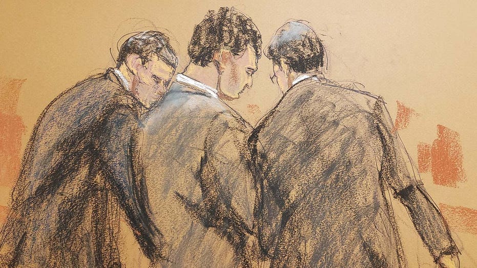 A court sketch of FTX founder Sam Bankman-Fried standing with his lawyers after the verdict is read in his fraud trial
