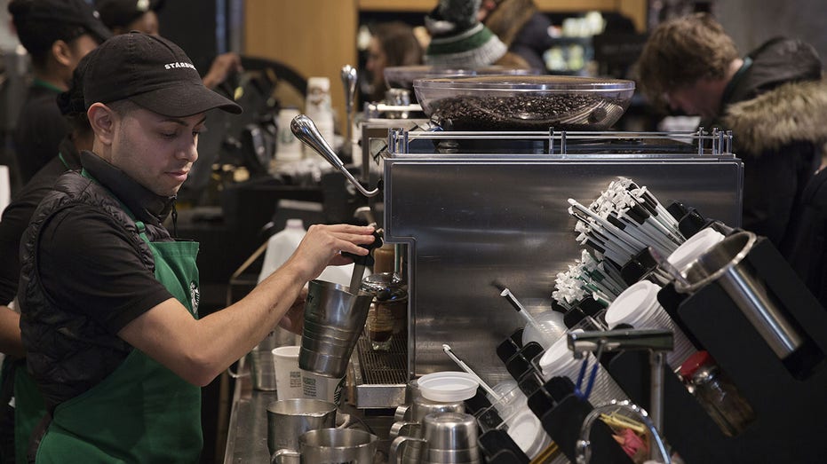 Starbucks barista makes drink