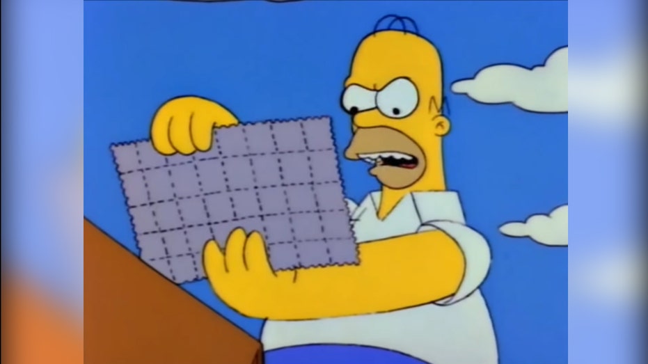 Homer Simpson looking at stamps