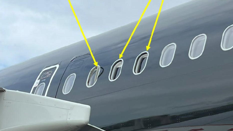 Two missing windowpanes on the plane