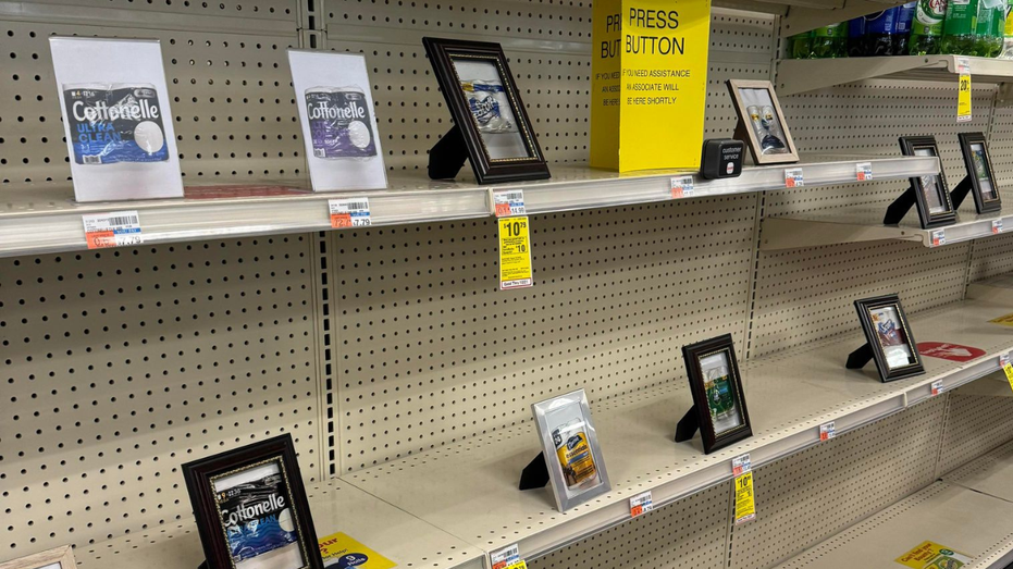 CVS store shelves with picture frames of paper products