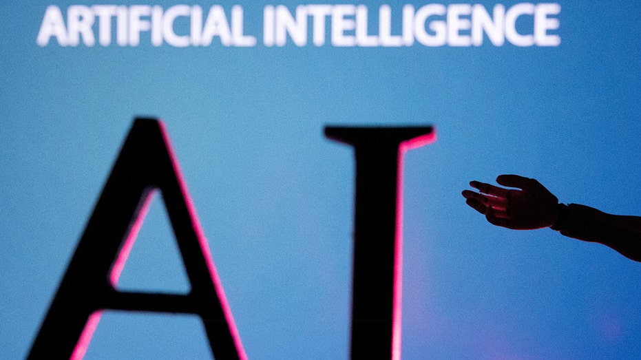 An illustration shows a robot hand extending towards the letters AI an is captioned, "artificial intelligence"