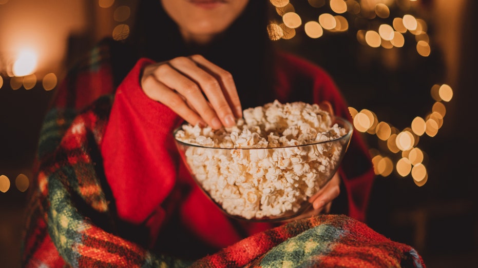 eating popcorn watching christmas movie