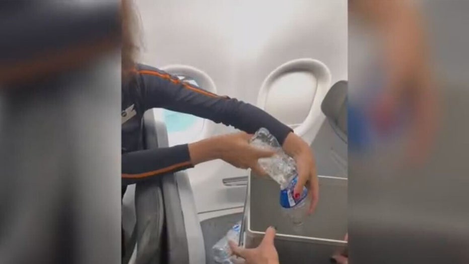 Flight attendants pour water