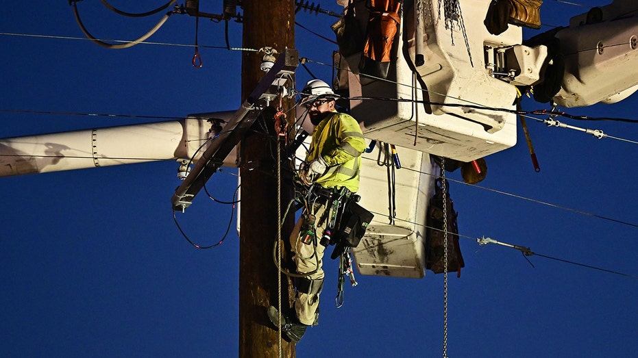 Workers replace power lines in Monterey Park, California