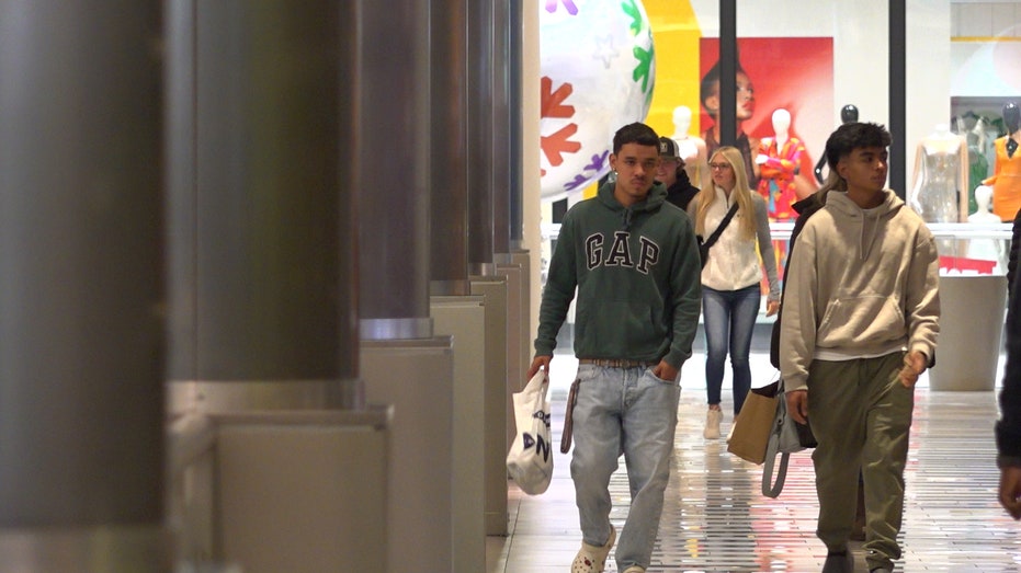 Two shoppers walking in the mall