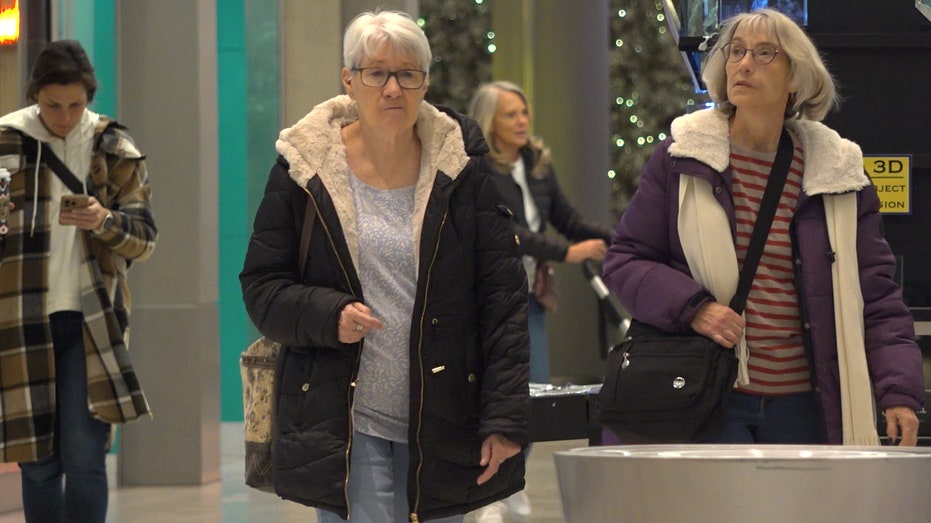 two women walk in the mall of america