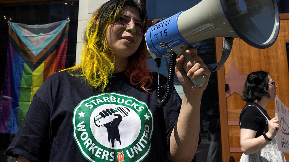 Starbucks workers attend a rally as part of a collective action