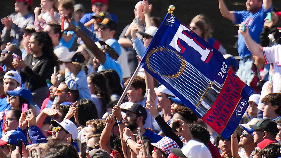 Fans celebrate the Rangers World Series win