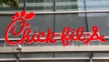 Chick Fil A logo and sign over restaurant, Manhattan, New York. 