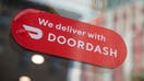 A restaurant displays a DoorDash logo in the Brooklyn borough of New York, US, on Saturday, Oct. 28, 2023. DoorDash Inc. is scheduled to release earnings figures on November 1. 