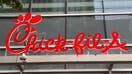 Chick Fil A logo and sign over restaurant, Manhattan, New York. 