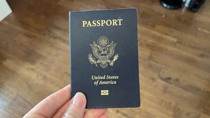 Person holding a United States passport with Department of State logo visible, Lafayette, California, May 23, 2023.