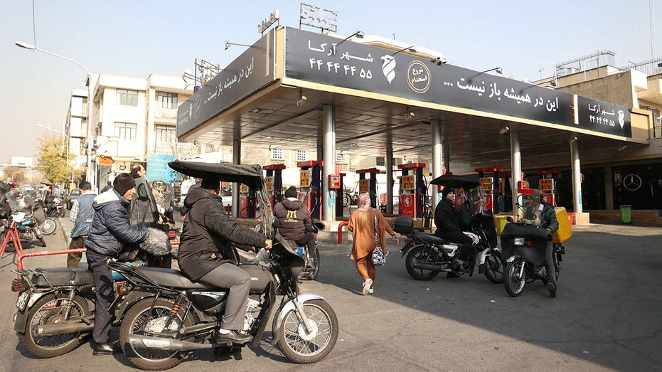 Iranians wait at gas station