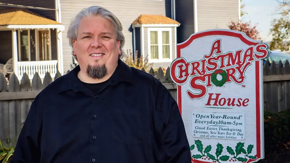 Josh with Christmas Story House museum sign