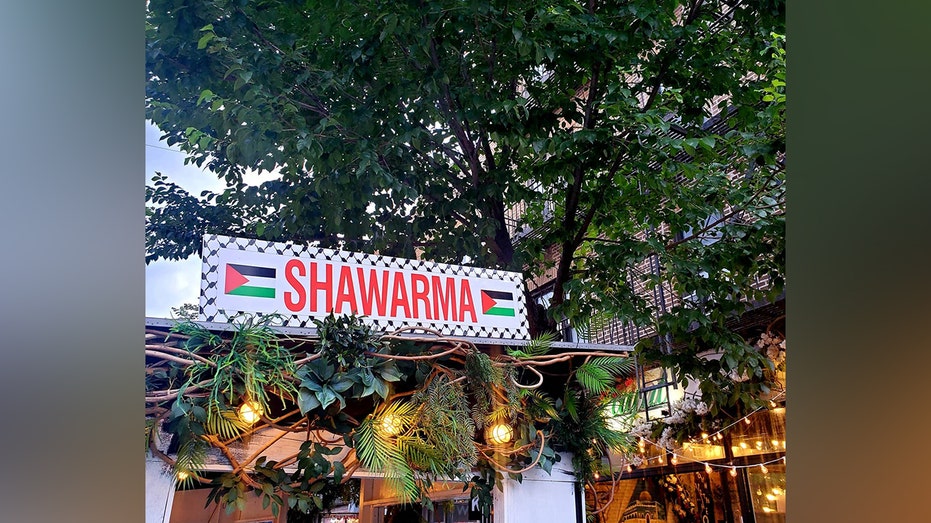Sign hanging outside Palestinian restaurant 'Ayat NYC'