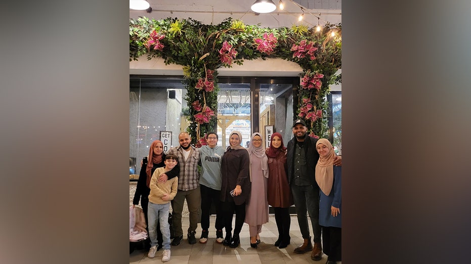 Abdul Elenani and a group inside his restaurant