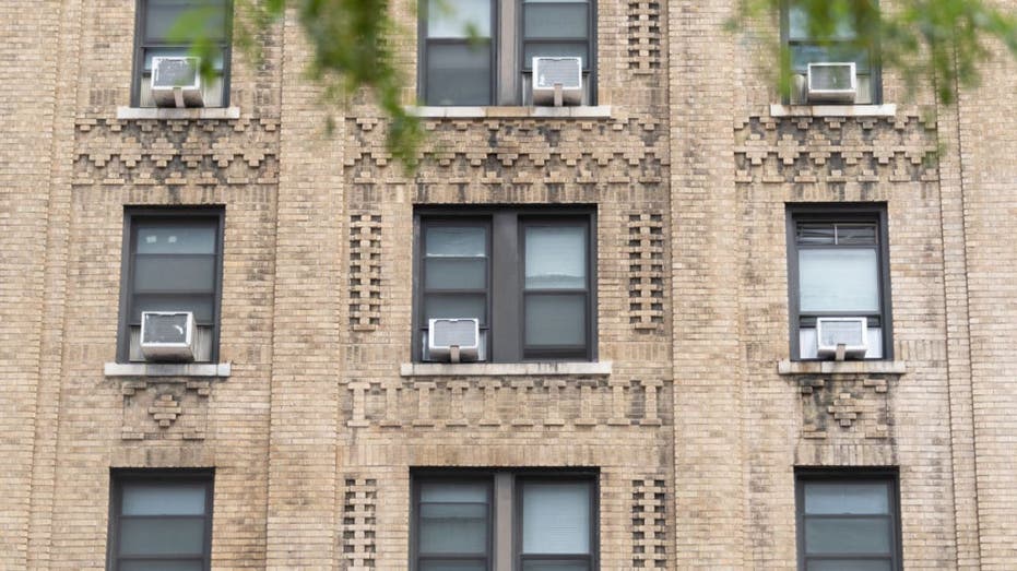 A builing with several air con units