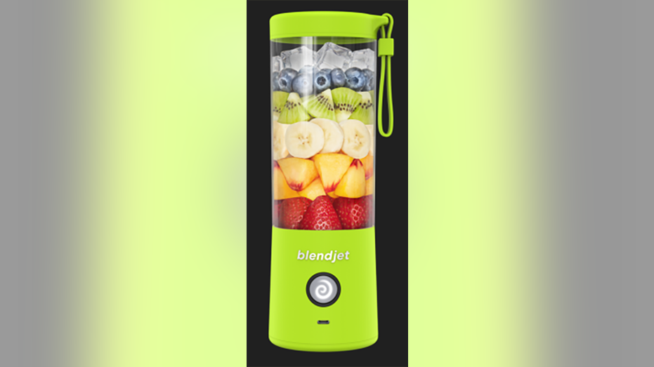 A photo of the blender with fruit