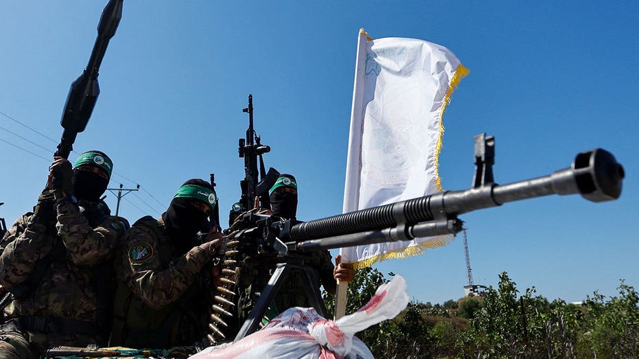 Hamas terrorists take part in a military parade