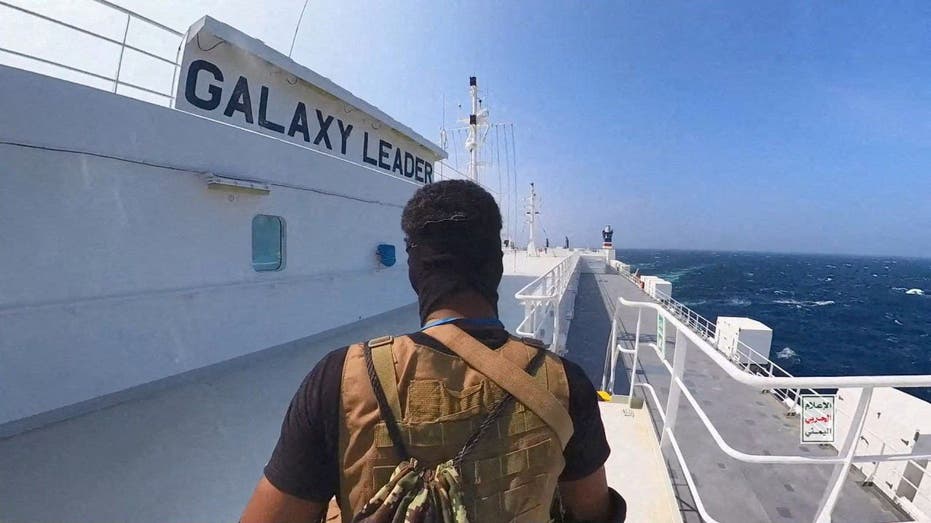 Houthi fighter on cargo ship in Red Sea