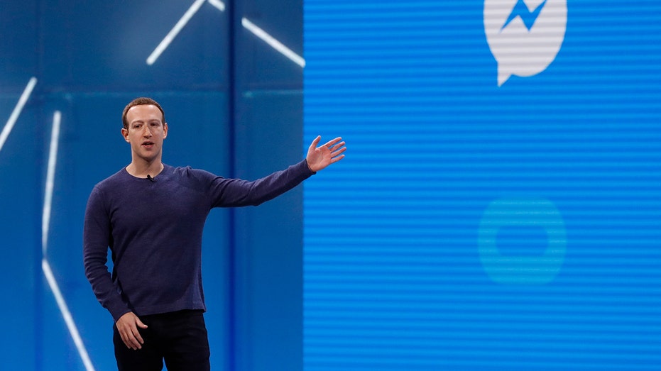 Mark Zuckerberg, Executive Chairman of Meta Platforms, points to the Facebook Messenger logo