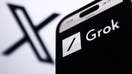X logo displayed on a laptop screen and xAI Grok website displayed on a phone screen are seen in this illustration photo taken in Krakow, Poland on December 8, 2023. - Fox Business News